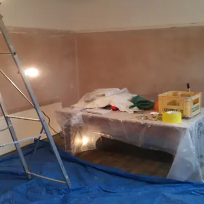 Freshly plastered room sheeted up ready for decorating